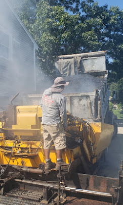 Asphalt roller on a fresh driveway